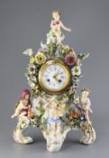 A large Meissen figural mantel clock, late 19th century, of cartouche shape and encrusted with