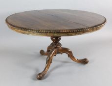 An early Victorian rosewood breakfast table, by Gillows, with circular tilt top, on fluted