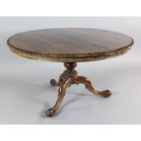 An early Victorian rosewood breakfast table, by Gillows, with circular tilt top, on fluted