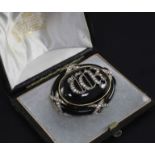 A Victorian gold, black enamel and rose cut diamond mourning pendant brooch in Hunt & Roskell fitted