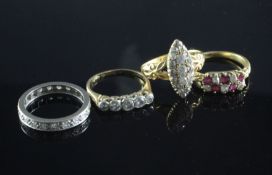 Four 18ct gold gem set rings including diamond cluster, ruby & diamond and a diamond full