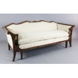 An 18th century style walnut settee, the show-wood frame carved in relief with flowers and foliate