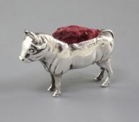 An Edwardian novelty silver pin cushion modelled as a bull by Adie & Lovekin, Birmingham, 1907, 2.