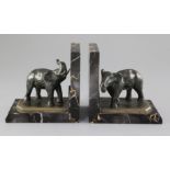 A. Marionnet. A pair of Art Deco bronze and variegated marble bookends, modelled as elephants, 5.
