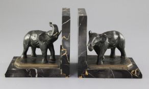 A. Marionnet. A pair of Art Deco bronze and variegated marble bookends, modelled as elephants, 5.