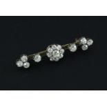 A late Victorian gold, silver and diamond cluster bar brooch, 1.75in.