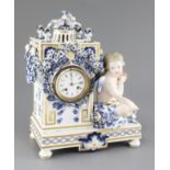 A Meissen figural mantel clock, late 19th century, of architectural form with the seated figure of
