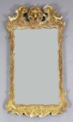 A George II carved giltwood and gesso wall mirror H. 3ft 2in. W.1ft 9in.
