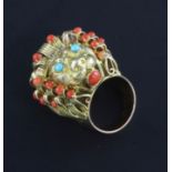 A 14ct gold, split coral and turquoise set dress ring, modelled as the head of a lion, size M.