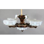 An early 20th century French coppered metal light fitting, with opalescent glass shades, drop 2ft,