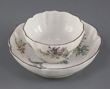 A Chelsea petal lobed tea bowl and saucer, c.1755, each painted with insects and floral sprays,