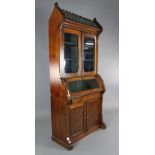 A Victorian Reformed Gothic parcel ebonised pitch pine bookcase, of architectural form, with