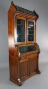 A Victorian Reformed Gothic parcel ebonised pitch pine bookcase, of architectural form, with