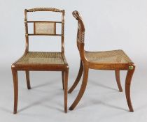 A set of eight Regency rosewood dining chairs, with ropetwist cresting rails, caned spars and