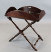 A George III mahogany butler's tray and folding stand, tray 3ft 6in. x 2ft 8in.