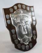 A large George V 1930's silver mounted oak presentation shield "The Ada Florence Cuthbert Memorial