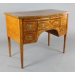 A George III rosewood banded satinwood bowfront dressing table, the top drawers opening out to