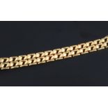 A stylish mid 20th century 14ct gold bracelet, with raised panelled links, 7.75in.