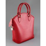 A Louis Vuitton red leather handbag, with original padlock and one key, in slip case, 12in.