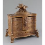 A late 19th century Black Forest carved wood jewellery casket, surmounted by two birds and carved