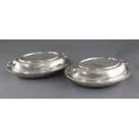 A pair of George V silver entree dishes and covers by Viner's Ltd, of oval form, with gadrooned