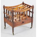 A George III mahogany canterbury, with base drawer and brass castors, W.1ft 7in. H.1ft 8in.