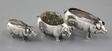 Two Adie & Lovekin novelty silver pin cushions modelled as pigs, Birmingham 1905 and 1906 and a Levi