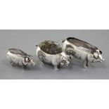 Two Adie & Lovekin novelty silver pin cushions modelled as pigs, Birmingham 1905 and 1906 and a Levi