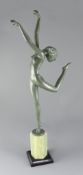 A green patinated bronze figure of a nude dancer in the style of Josef Lorenzl, signed on the