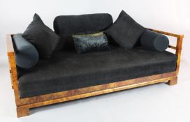 A Continental Art Deco walnut settee, with show-wood frame and black fabric upholstery, W.6ft