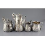 A Victorian silver four piece tea and coffee service by Robert Hutton, of tapering cylindrical