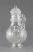 A French cut crystal claret jug and cover, late 19th century, probably Baccarat, the pear shaped