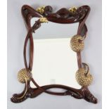 An Art Nouveau style parcel gilt hardwood wall mirror, of scrolling foliate design, W.3ft 3in. H.3ft