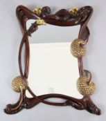 An Art Nouveau style parcel gilt hardwood wall mirror, of scrolling foliate design, W.3ft 3in. H.3ft