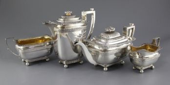 A George V four piece silver tea set by John, Hunt, of rounded rectangular form, with "basket weave"