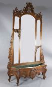 An early 20th century French carved walnut hall mirror, with serpentine jardinière base and three