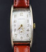 A gentleman's stylish 1930's gold plated Longines manual wind wrist watch, with rectangular Arabic