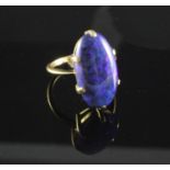 A gold and black opal ring, of good colour, the oval stone measuring approximately 20mm in length,