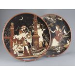 Heinrich Schlitt for Mettlach - two stoneware chargers, c.1900, the first decorated with a Greek