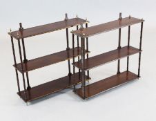 A pair of Regency style brass strung mahogany three tier wall shelves, W.2ft H.1ft 11in. D.6.5in.