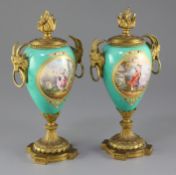 A pair of 19th century French ormolu mounted Sevres style jewelled porcelain cassoulets, each