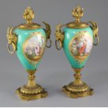 A pair of 19th century French ormolu mounted Sevres style jewelled porcelain cassoulets, each