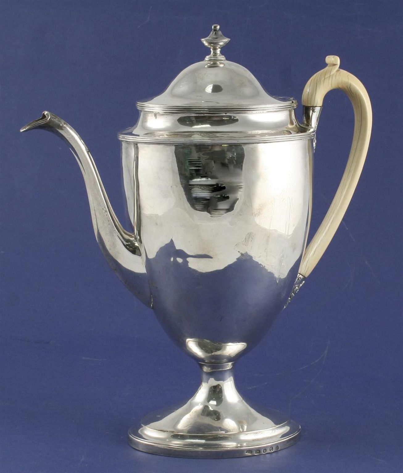 A George III silver urn shaped pedestal coffee pot, with ivory handle and plain body, on oval