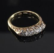 An early 20th century 18ct gold and graduated five stone diamond ring, set with old round cut