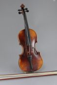 A Sebastian Kloz of Mittenwald violin, cased with two bows, 23in.