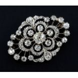 A Victorian gold, silver and diamond brooch, of quatrefoil shape and set with old mine cut