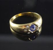 A late Victorian 18ct gold, gypsy set sapphire and diamond ring, with oval cut sapphire and rose cut