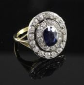 A 1940's gold, synthetic? sapphire and diamond cluster ring, of oval form, the central oval cut