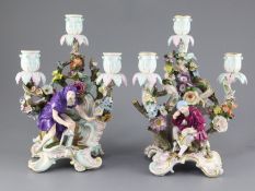 A pair Meissen figural three branch candelabra, late 19th century, each modelled with rococo scrolls