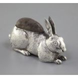 An Edwardian novelty silver pin cushion modelled as a rabbit by Adie & Lovekin, Birmingham, 1907,